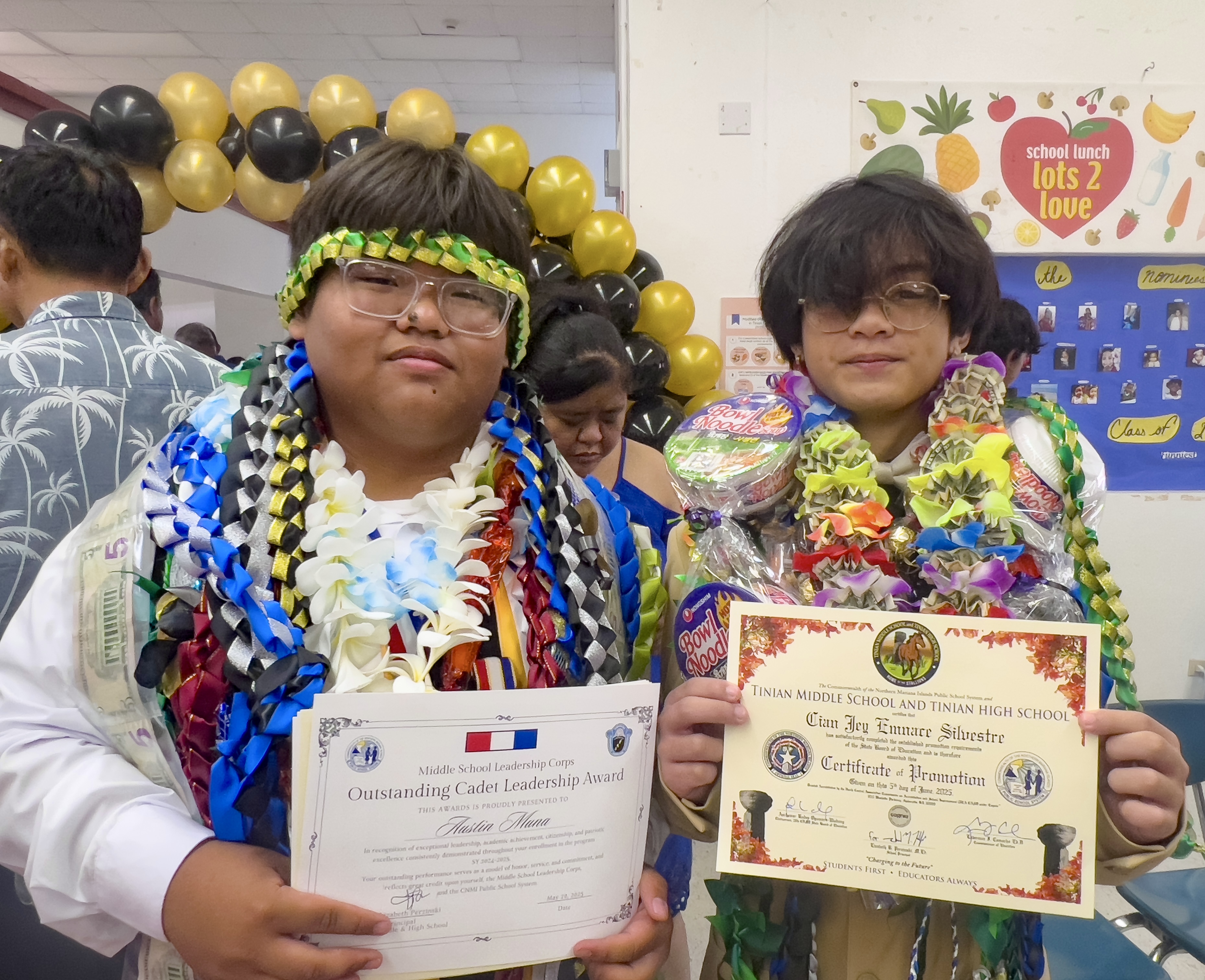 Promoted students Austin Muna, left, and Cian Silvestre pose for a photo.