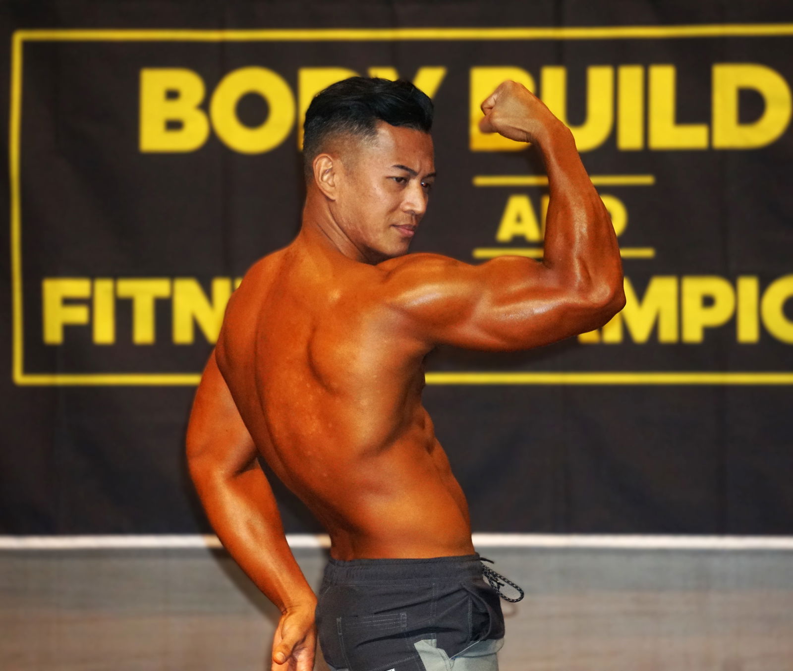 Reymark Castro strikes a pose in the Men's Physique category.