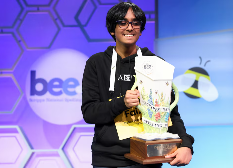 Faizan Zaki, 13, of Dallas, Texas, holds the prize after winning the annual Scripps National Spelling Bee in National Harbor, Maryland, May 29, 2025.REUTERS