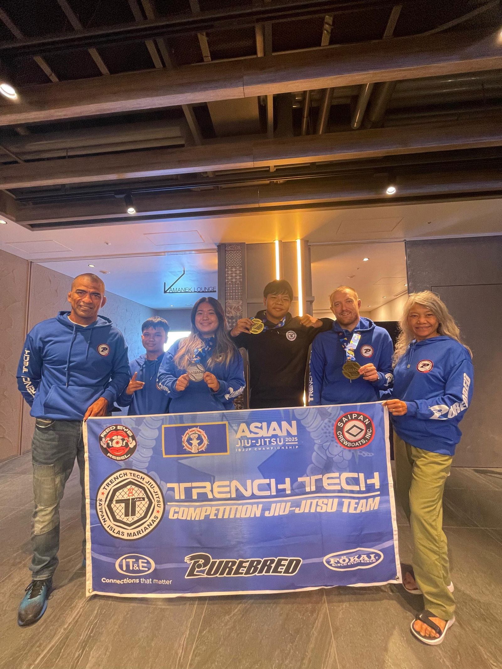 Trench Tech’s head coach Cuki Alvarez with Drey Aldan, Jessica Ma, Noah Quitugua, Daryn Roufs, and team manager Mariana Alvarez.Contributed photo