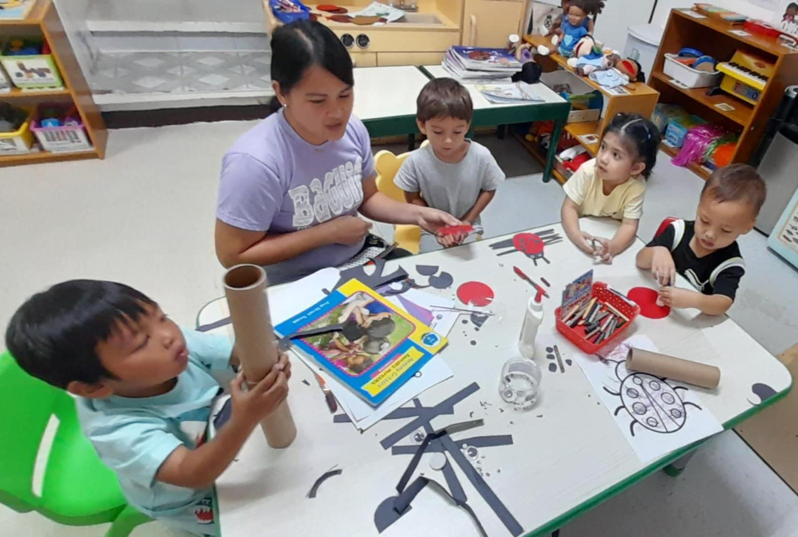 K4 students from Gualo Rai are busy creating their insect-themed art projects.