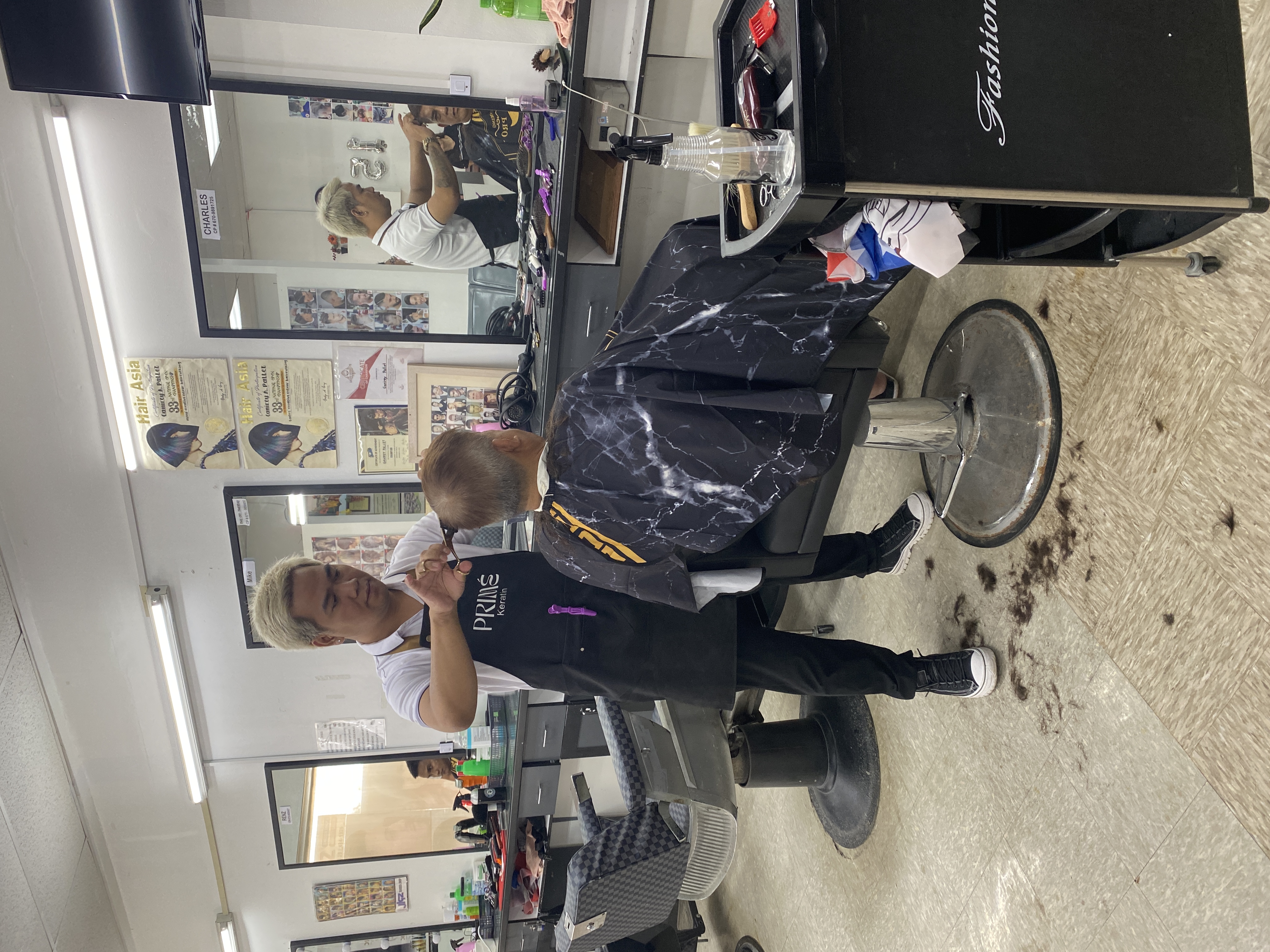 Stylist Charles Pallet in action at Jigz barbershop.