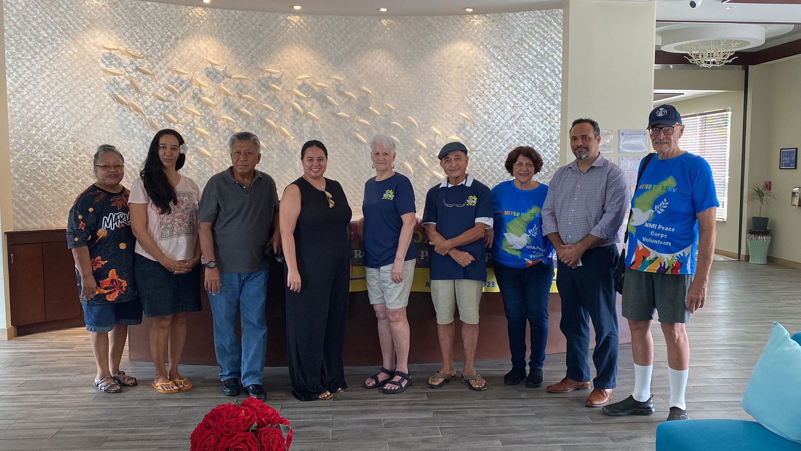 The Humanities Council’s Gin Smith, 4th from left, and Leo Pangelinan, 2nd from right, appreciated the monetary donation from the former Peace Corps volunteers.