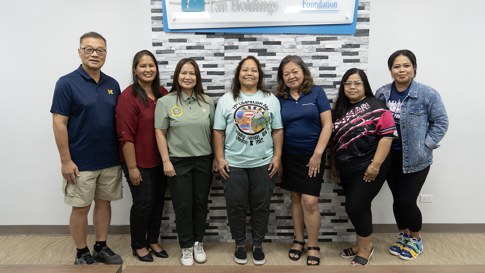 The Liberation Day Committee accepts a $5,000 donation from TSL Foundation Executive Director Merlie Tolentino, third left, Tan Holdings President & CEO Jerry Tan, far left, and VP for Community Relations Catherine Attao, second left.Contributed photo