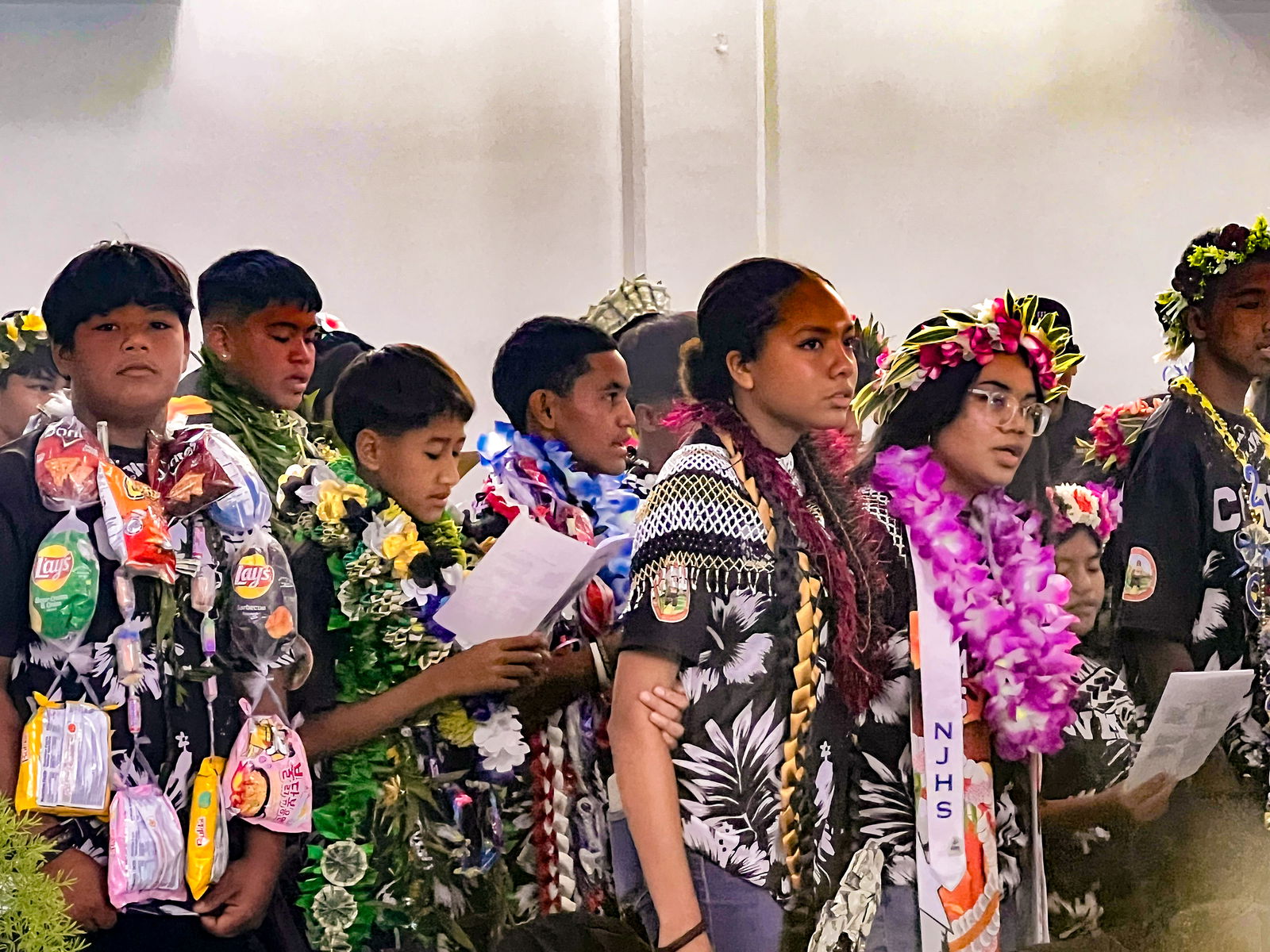 The promoted students perform for the school community.