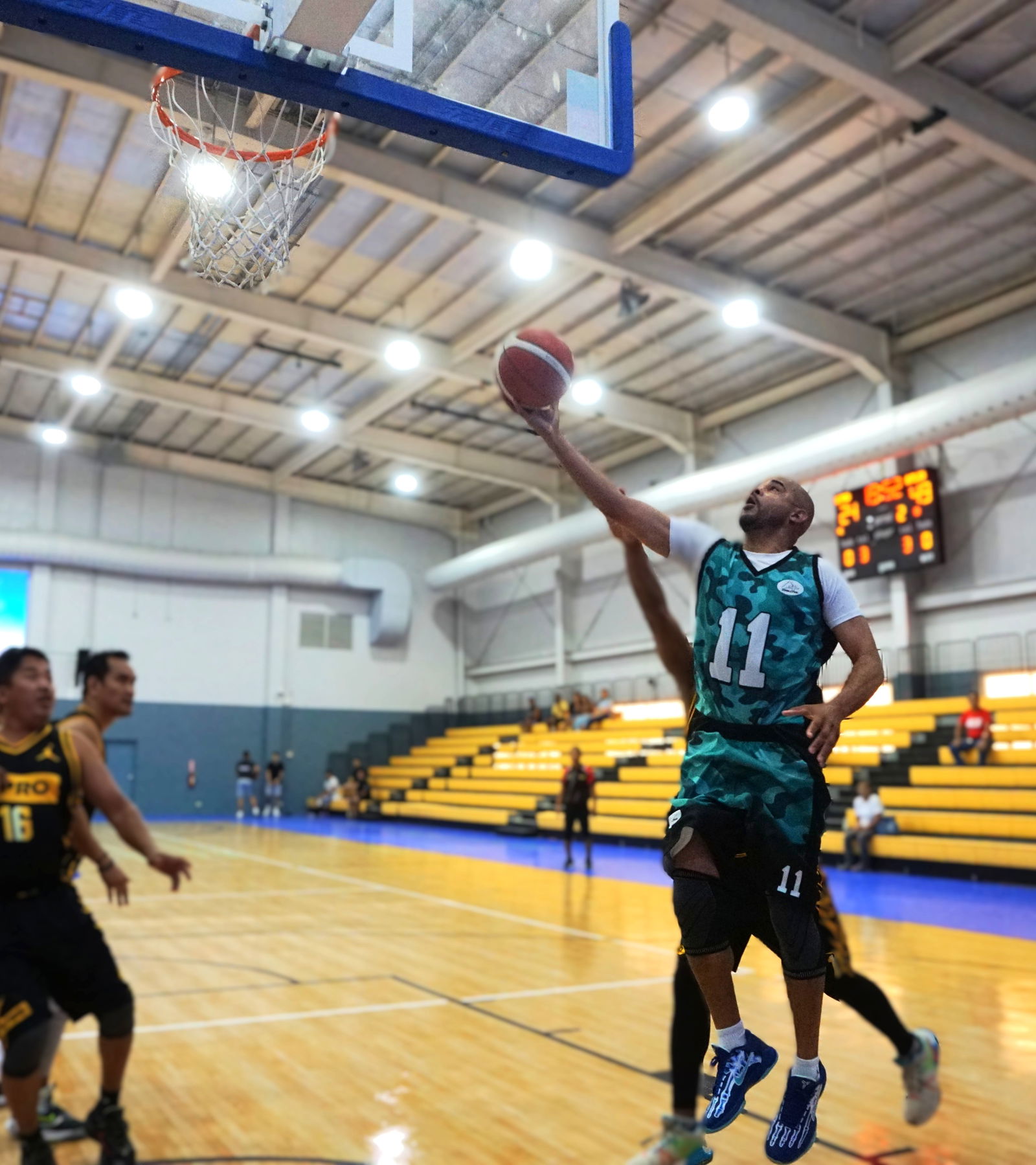A+'s Andrew Ashburn extends for the finish after evading a KPro defender during the masters division championship game of the 2025 IT&E-United Filipino Organization Basketball League at the Ada gym on Saturday.Photo by James F. Sablan Jr.