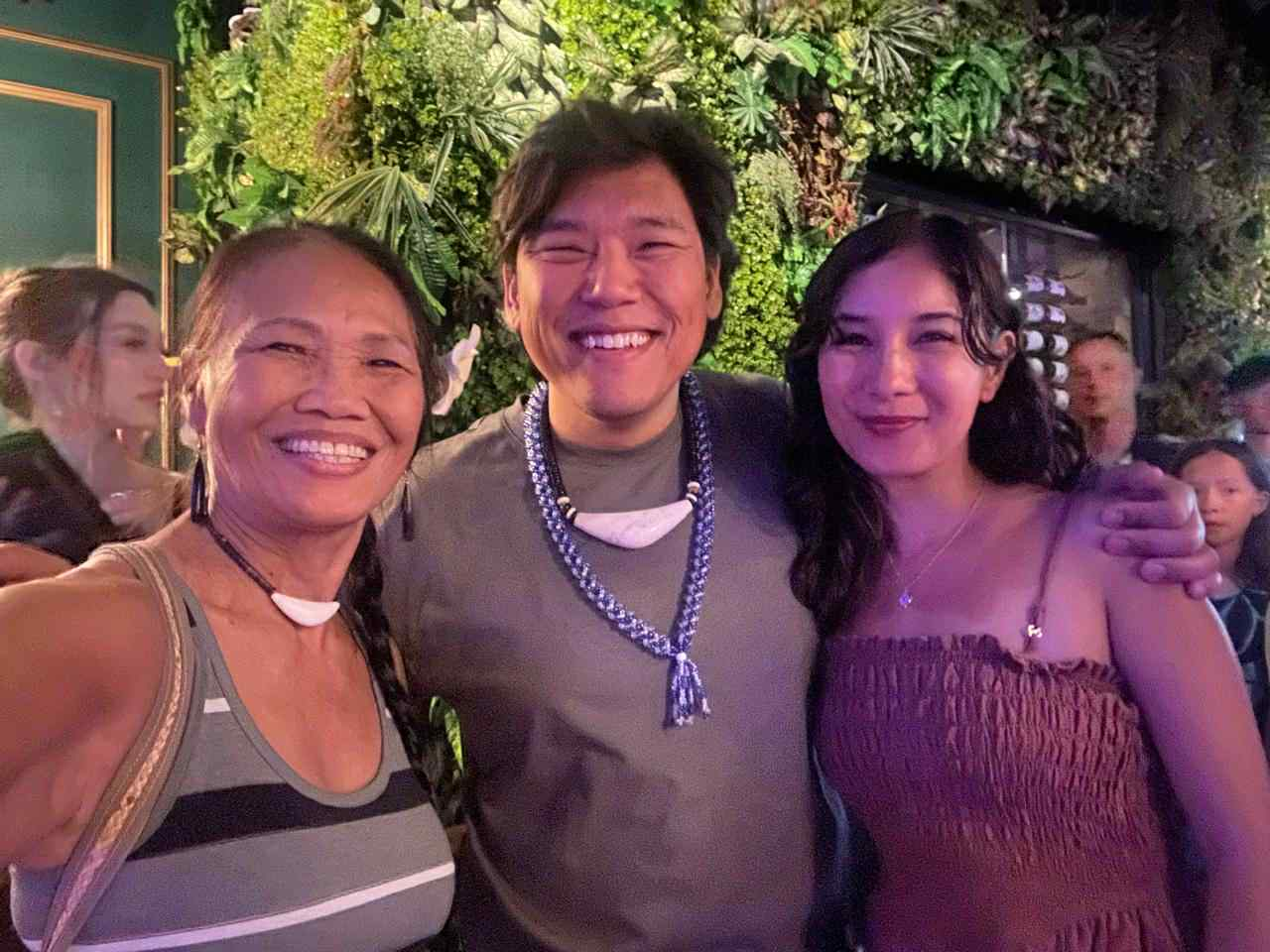 From left, Frances Sablan, Andrew Gumataotao and Samantha Barnett attend a performance during the 2024 Festival of Pacific Arts and Culture.