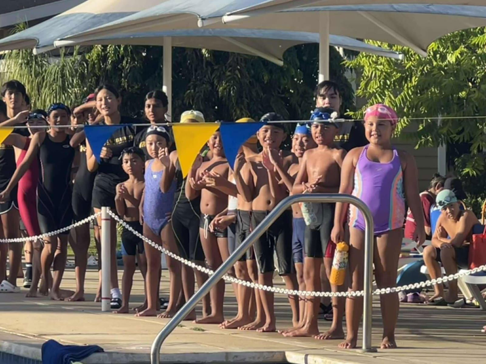 Swimmers line up as they get ready for their races.