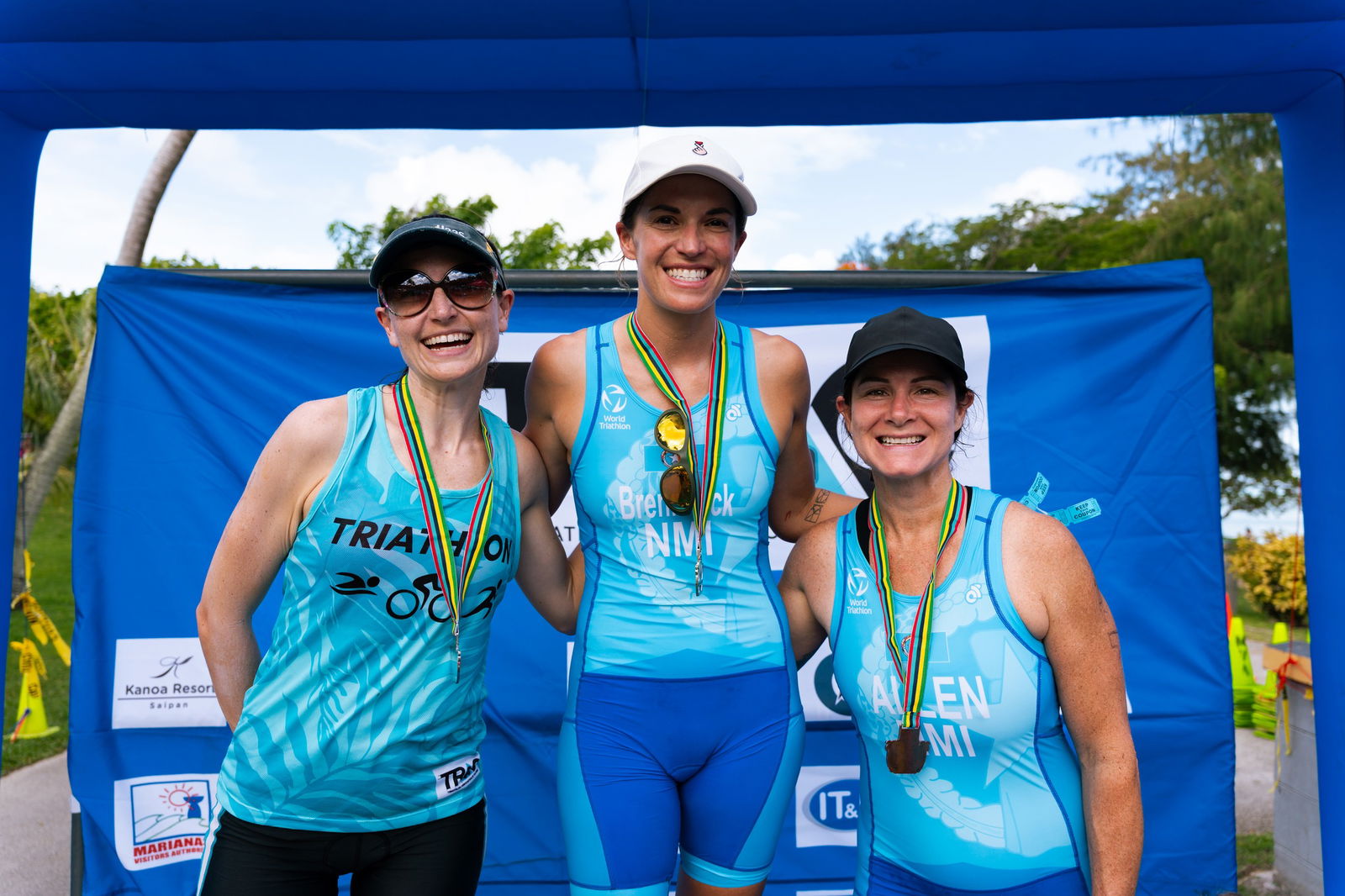 Shawn Brennfleck, Heather Brook, and Terra Allen are the top three finishers in the women's division of the Triathlon Association of the CNMI's "Just Tri-It" triathlon at  Paupau Beach on Saturday.