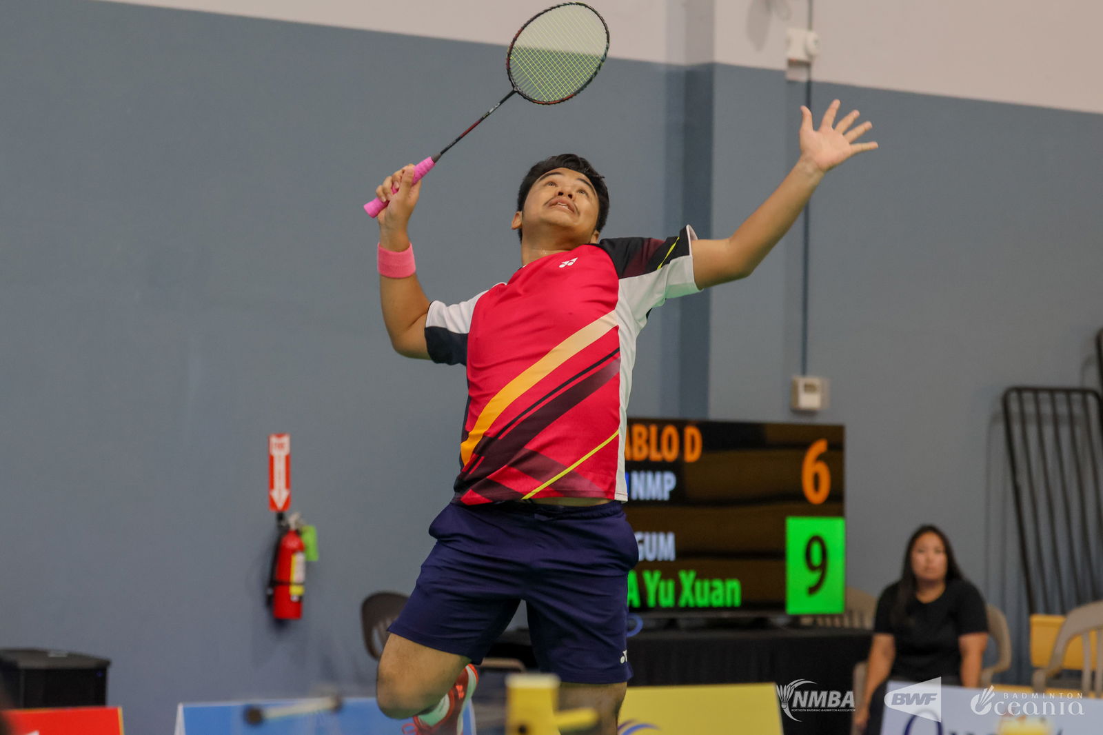 NMI’s Daniell Pablo winds up for a powerful smash return against Guam's Yu Xia during a men's singles match of the Northern Marianas International 2025 at the Ada gym on Tuesday.Northern Marianas Badminton Association photo