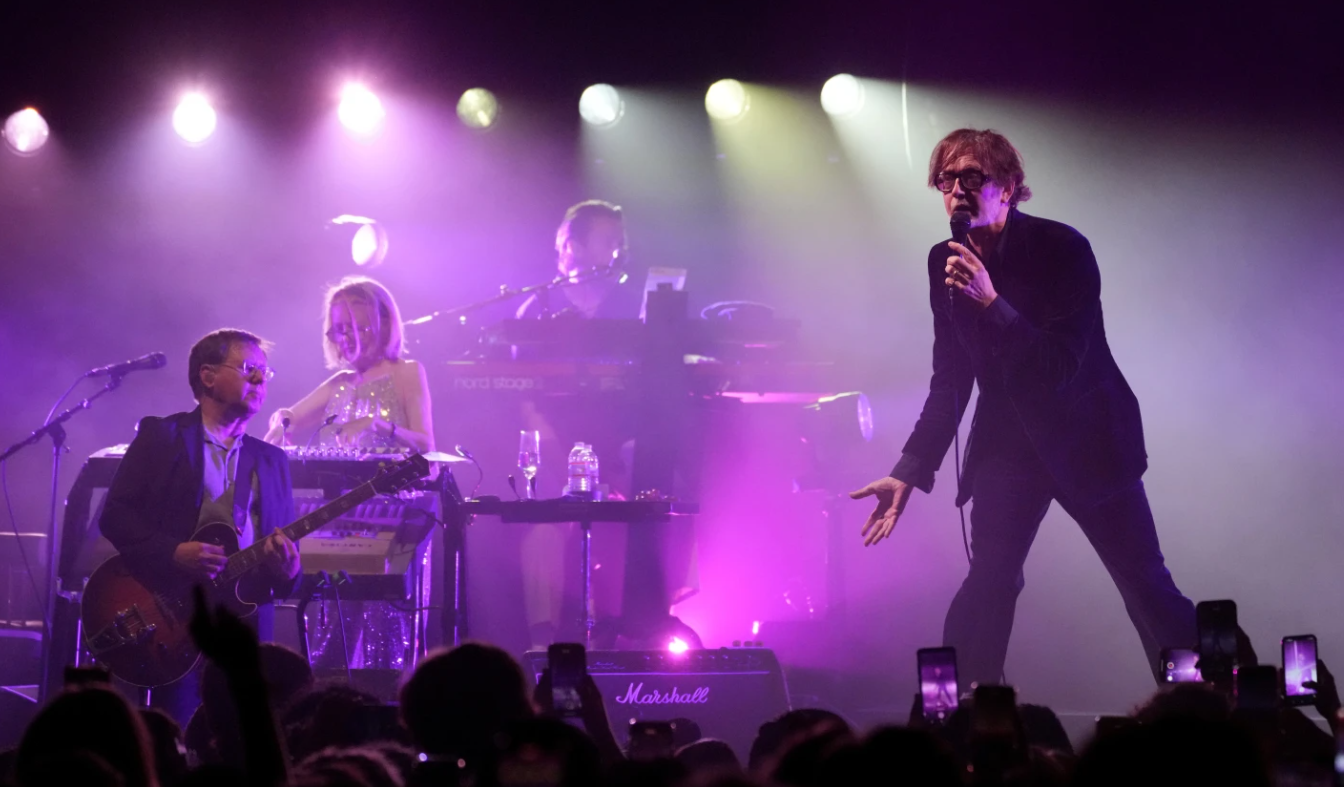 Jarvis Cocker, right, and Mark Webber, from left, and Candida Doyle of the band Pulp, perform at the Hollywood Palladium in Los Angeles on Sept. 18, 2024.AP