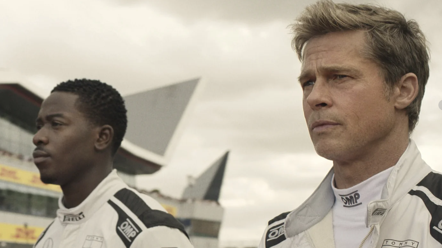 Damson Idris as Joshua Pearce, left, and Brad Pitt as Sonny Hayes in a scene from “F1 The Movie.”Apple TV+ via AP