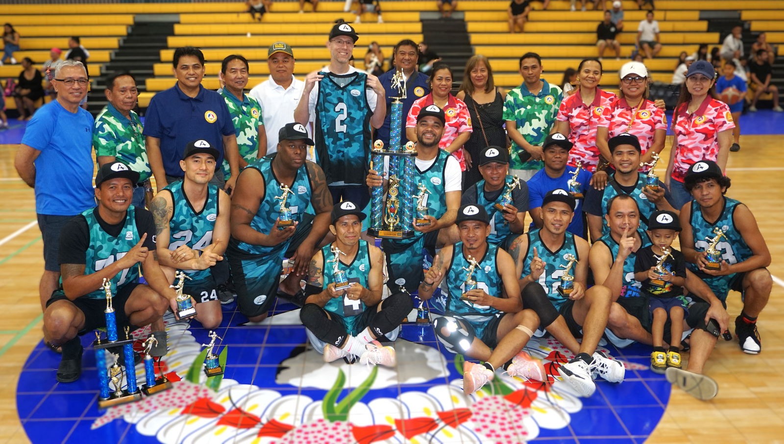 A+ Consulting players pose with the masters division championship trophy of the 2025 IT&E-United Filipino Organization Basketball League at the Ada gym on Saturday.  Also in photo: tournament organizers and officials.Photo by James F. Sablan Jr.