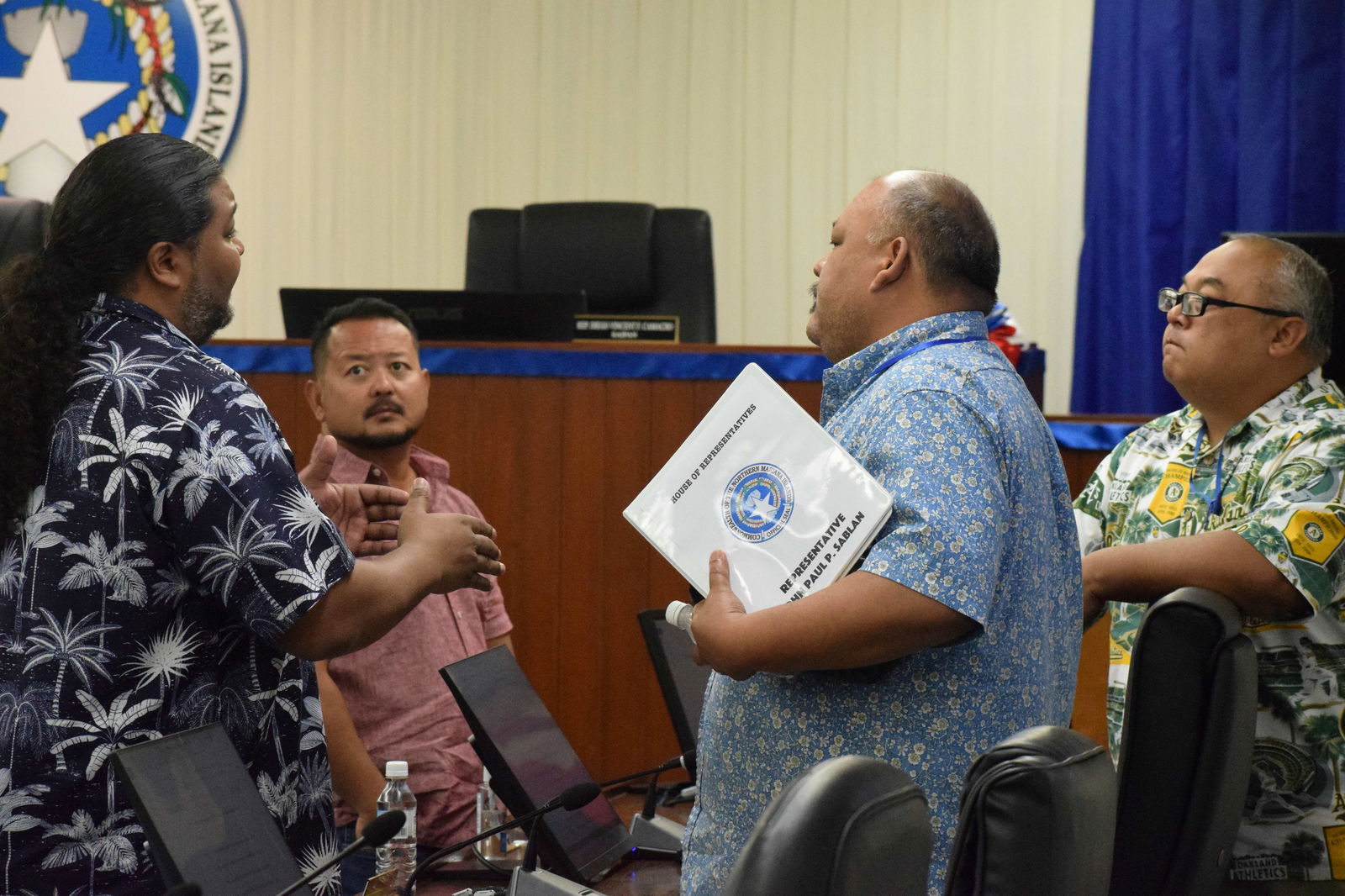 House Ways and Means Committee Chairman John Paul P. Sablan, right, listens to Senate Vice President Karl King-Nabors, left, at the conclusion of a bicameral conference committee meeting in the House chamber on Tuesday. Also in photo are Rep. Joel Camacho and Rep. Blas Jonathan Attao.Photo by Emmanuel T. Erediano