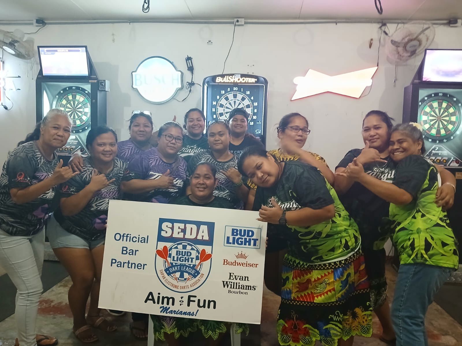 True North Lady Langilang and 9Eleven Throwing Shade players pose for a group photo after completing their match in the ladies division of the 2025 SEDA Bud Light Dart League on Monday at the True North Bar.