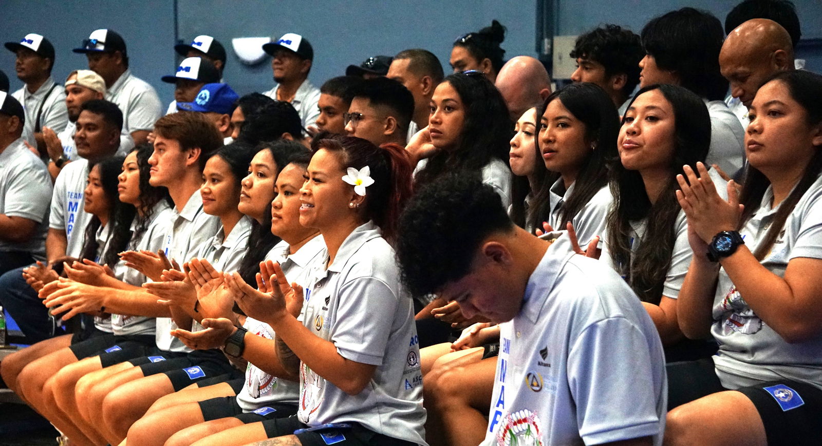 Team Marianas athletes applaud Northern Marianas Sports Association President Jerry Tan — not in photo — as he deliver his remarks during the Team Marianas send-off ceremony at the Ada gym on Monday. The local athletes are headed to Palau where they will see action in the Pacific Mini Games.Photo by James F. Sablan Jr.