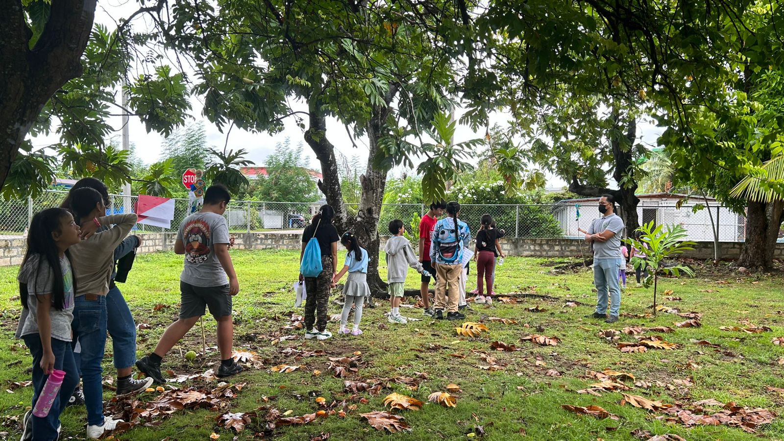 Campers explore and gather materials for their Nature Wind Chime project.