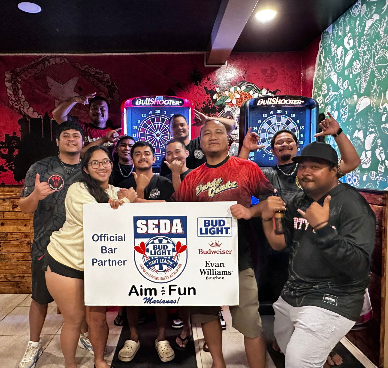 Black 8 Darty Gentz and The Hut North Side Darterz pose for a group photo after their match in the Kingfisher C Division of the 2025 SEDA Bud Light Dart League at The Hut on Wednesday.Contributed photo
