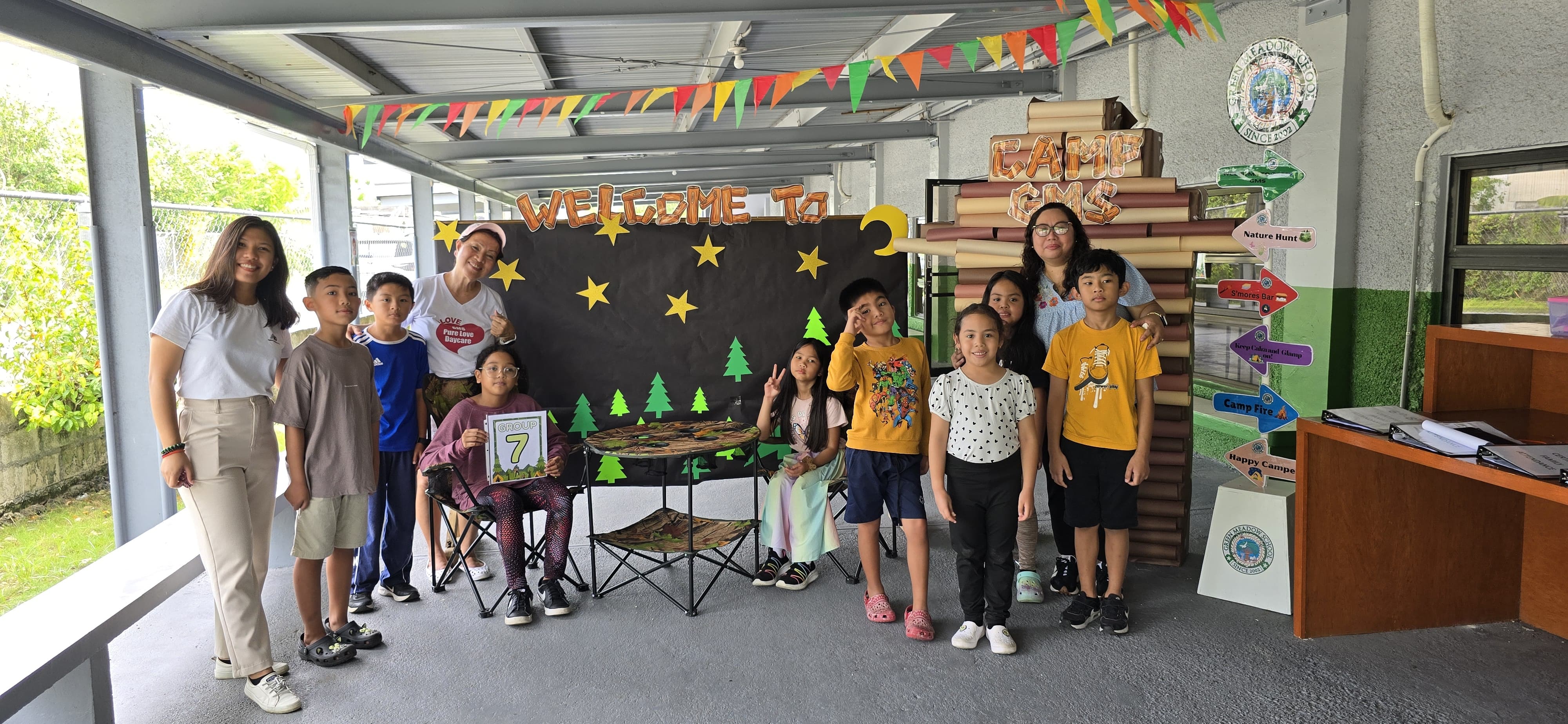 Campers from both elementary and middle school cheerfully pose to mark their first week of camp.