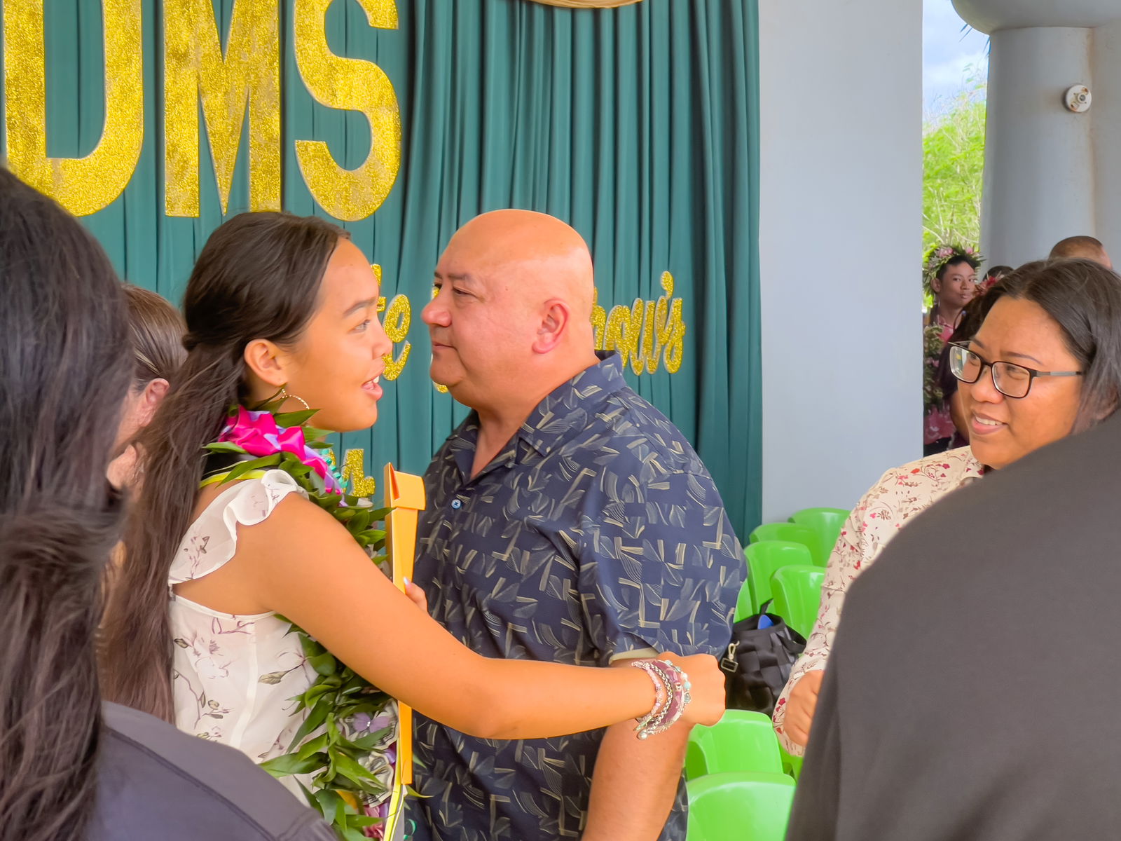 A promoted student is congratulated by Dr. Lorraine Catienza, PSS Instructional Technology and Distance Education Program director.