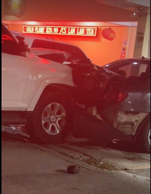 A white 4Runner hit a parked Corolla, pushing it into Han Nam Supermarket on the evening of June 1, 2025.Facebook photo