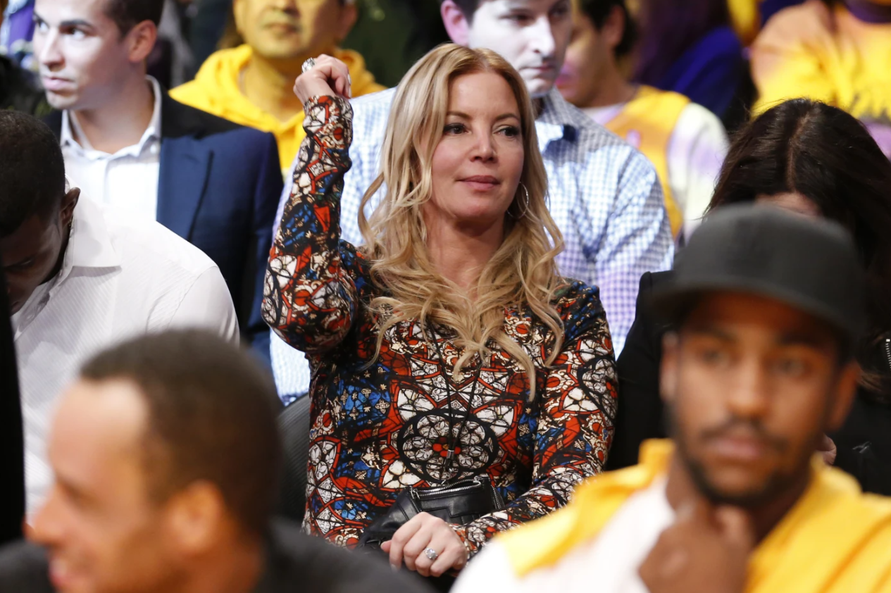 Los Angeles Lakers President Jeanie Buss dances in her seat to music as she attends the NBA game between her team and the Los Angeles Clippers in Los Angeles, Oct. 29, 2013.AP