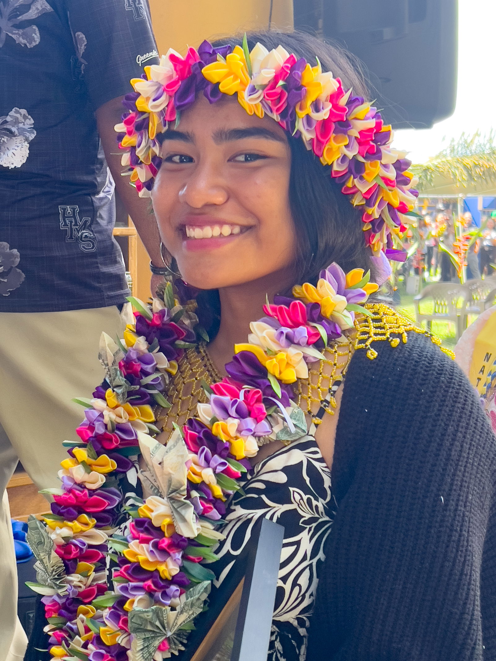 A newly promoted Hopwood student smiles for the camera.