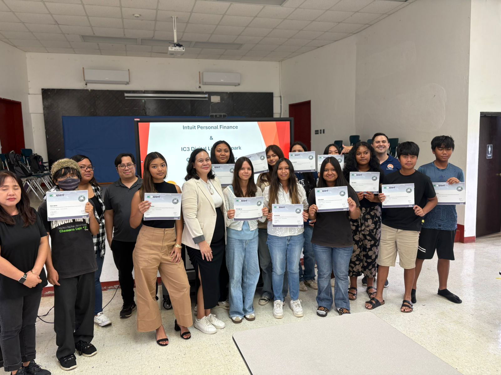 The Tinian Middle School IC3 Spark Section 2 students with Island Training Solutions Chief Operating Officer Alex Hu, third right.