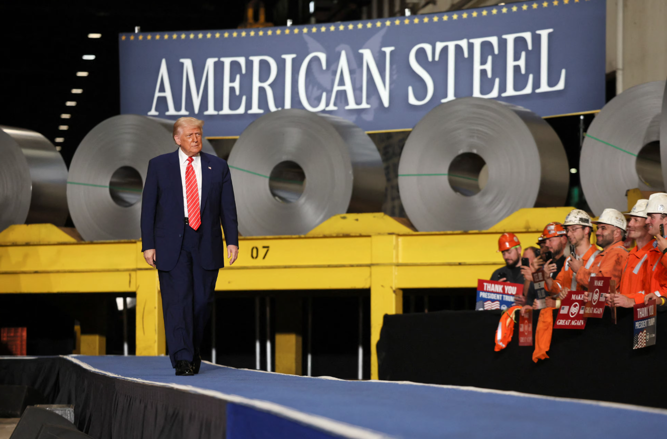 President Donald Trump walks as workers react at U.S. Steel Corporation–Irvin Works in West Mifflin, Pennsylvania, May 30, 2025.REUTERS