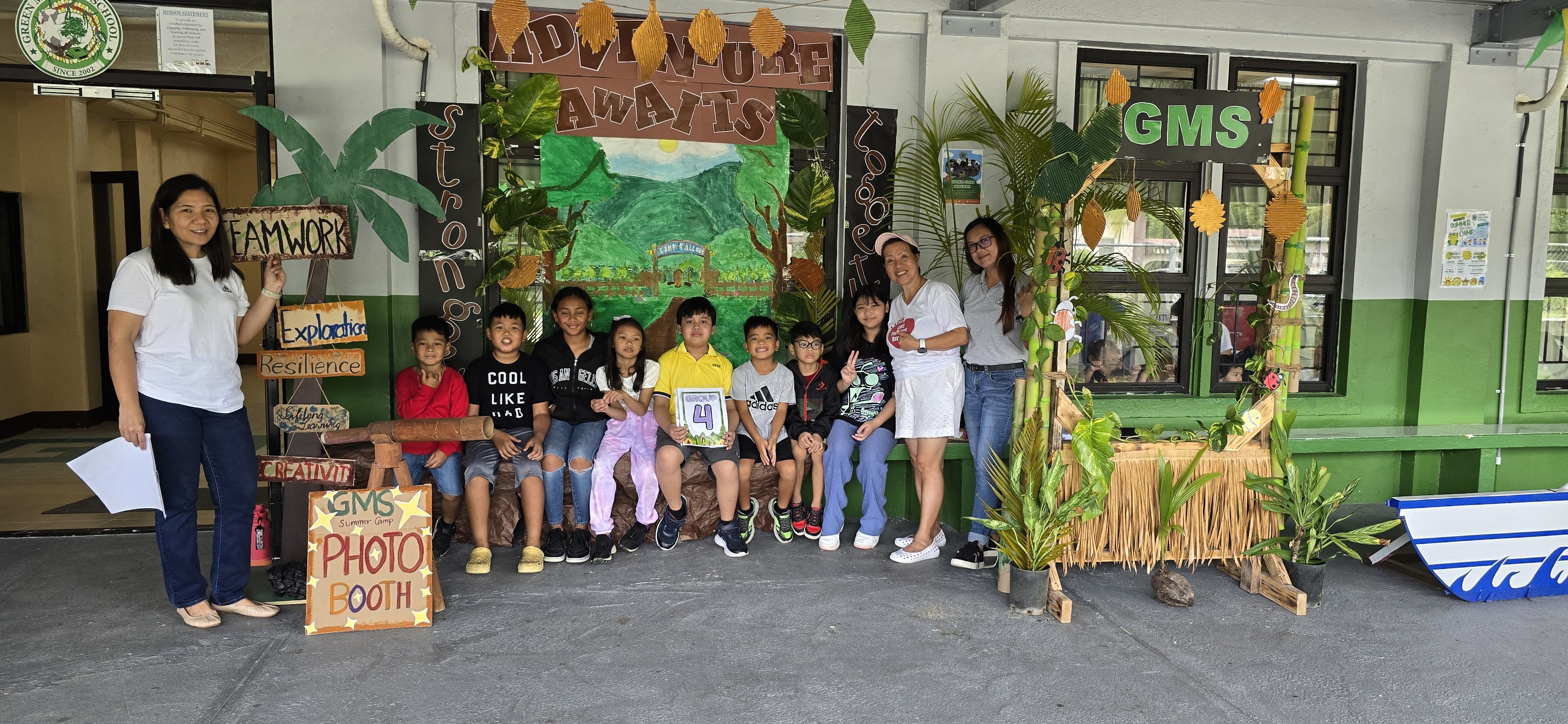 Campers from both elementary and middle school cheerfully pose to mark their first week of camp.