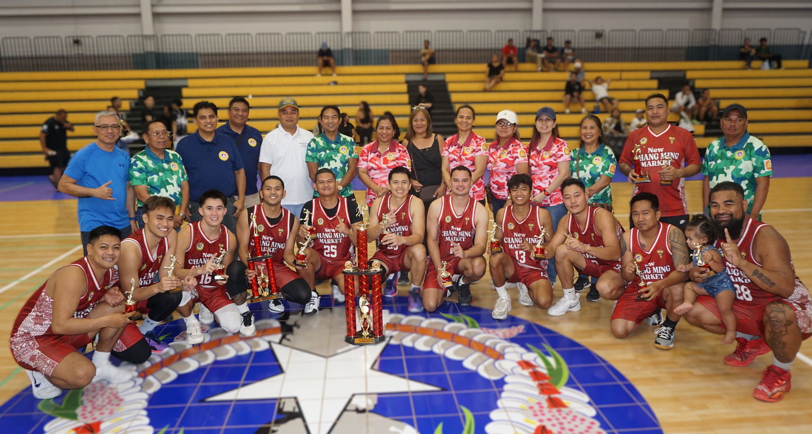 New Changming Market players pose with the open division trophy of the 2025 IT&E-United Filipino Organization Basketball League along with UFO officers during the awards ceremony at the Ada gym on Saturday.Photo by James F. Sablan Jr.