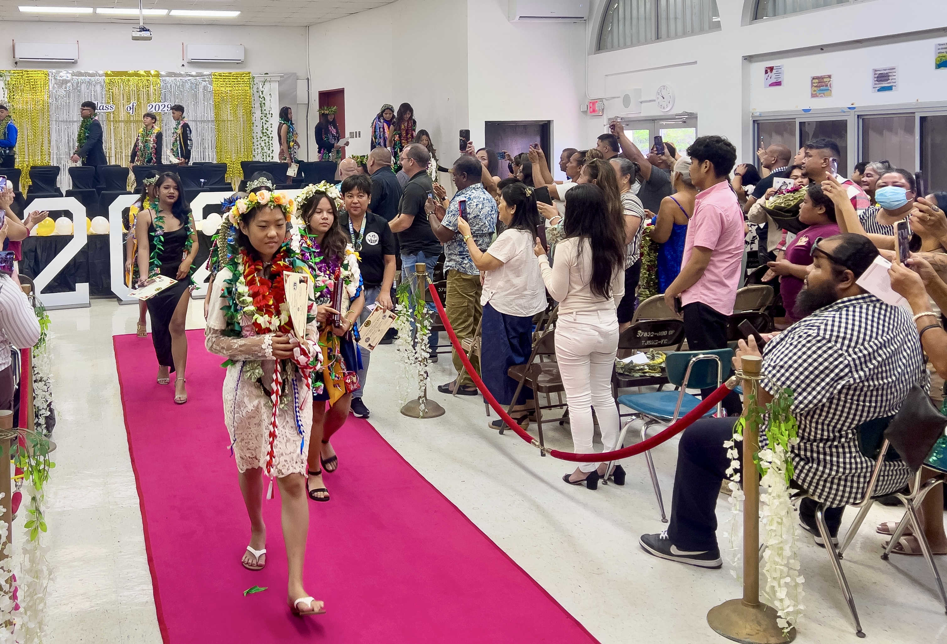 Parents and community members applaud the promoted students.