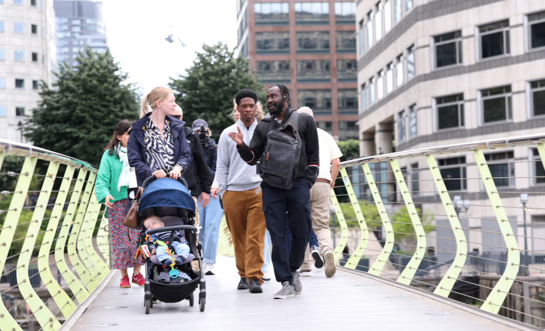 Unseen Tours guide Stefan Gordon leads a tour around Canary Wharf's West India Quay in London, Britain, June 10, 2025.REUTERS