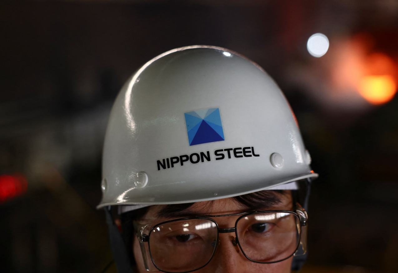 A worker wears a helmet with The Nippon Steel logo, inside the plate rolling mill area at the company's East Nippon Works Kimitsu Area plant in Kimitsu, east of Tokyo, Japan on May 26, 2025.REUTERS
