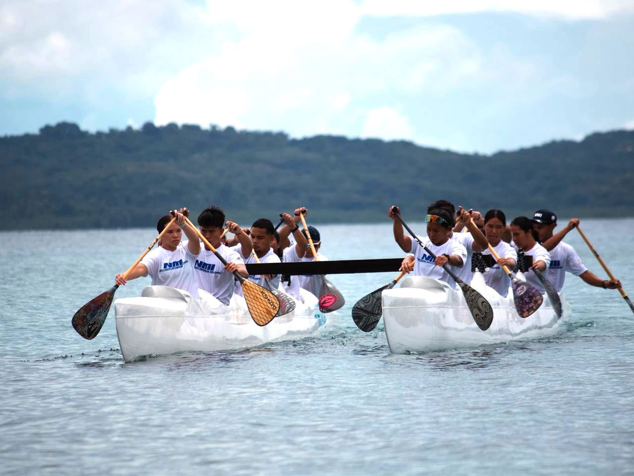 The NMI men’s and women’s paddlers train in the waters of Meyuns Ramp. Marianas Press via NMSA