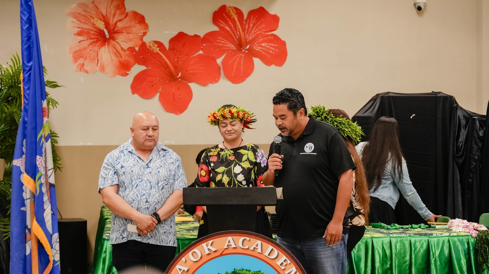 BOE Chairman Aschumar Kodep Ogumor-Uludong, right, with Commissioner of Education Dr. Lawrence F. Camacho, left, and Da’ok Academy Principal Christine M. Tudela.