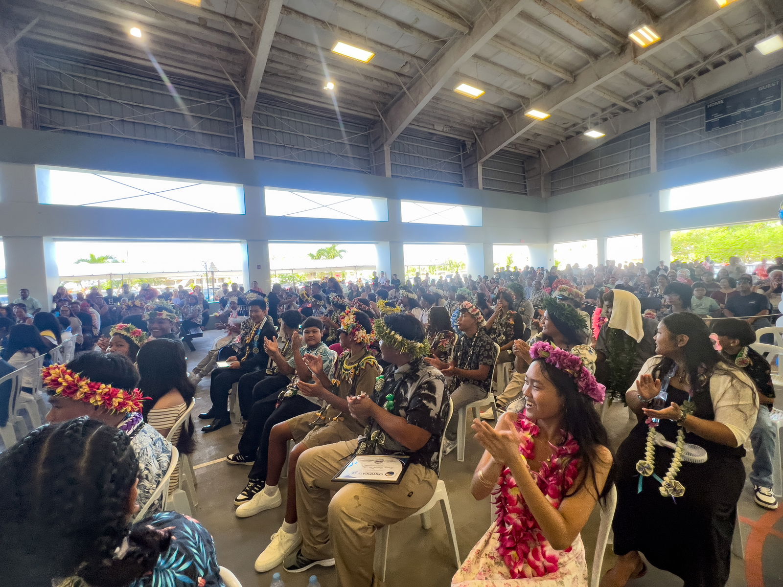 The Napu Riders cheer after receiving their certificates of promotion to high school.