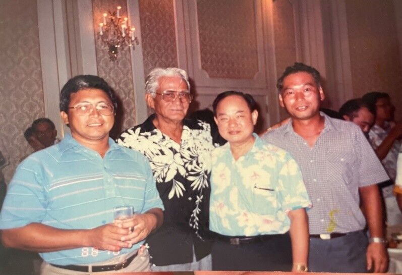 Sen. Juan S. Torres, left, with Tun Manet Kiyu Villagomez, 2nd left, and off-island guests.