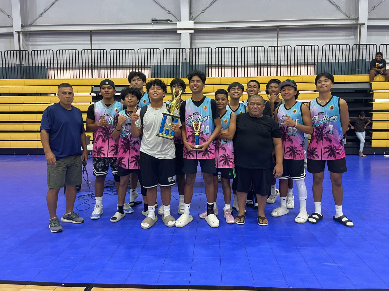 Prime and GR-Sixers players pose with Rep. Elias Rangamar as champions of their respective divisions in the Liberation Day Friendship Basketball Tournament held at the Ada Gym on Thursday.Contributed photos