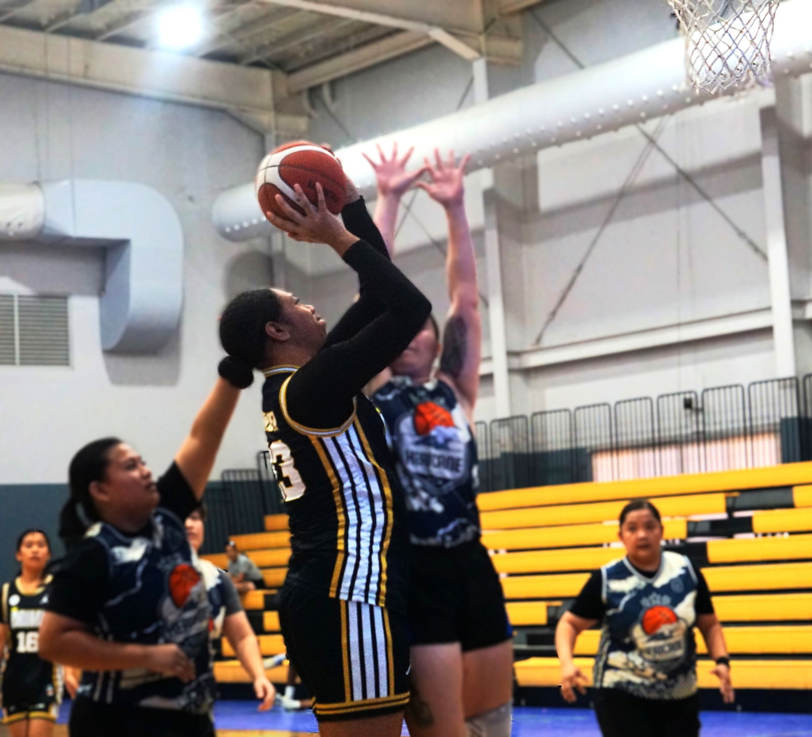 Prime's Azriel Fatialofa goes up for the heavily contested shot during a game against the Hericanes in the Ladies Division of the 2025 Allied Pacific Environmental Corporation Basketball League  at the Ada gym.