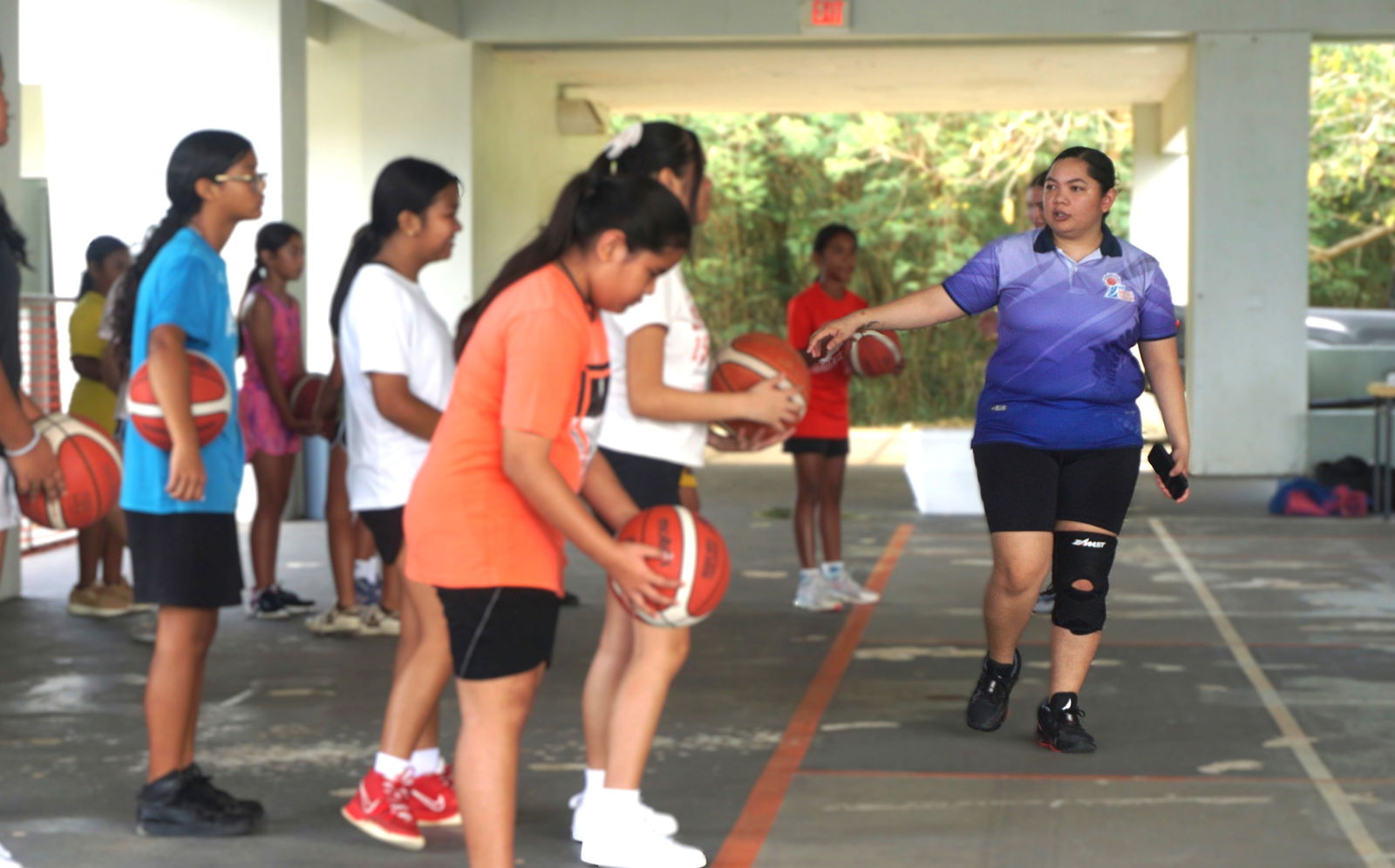 NMI Basketball Federation board member Marlene Lumabi leads a February camp at Koblerville gym.Photo by James F. Sablan Jr.