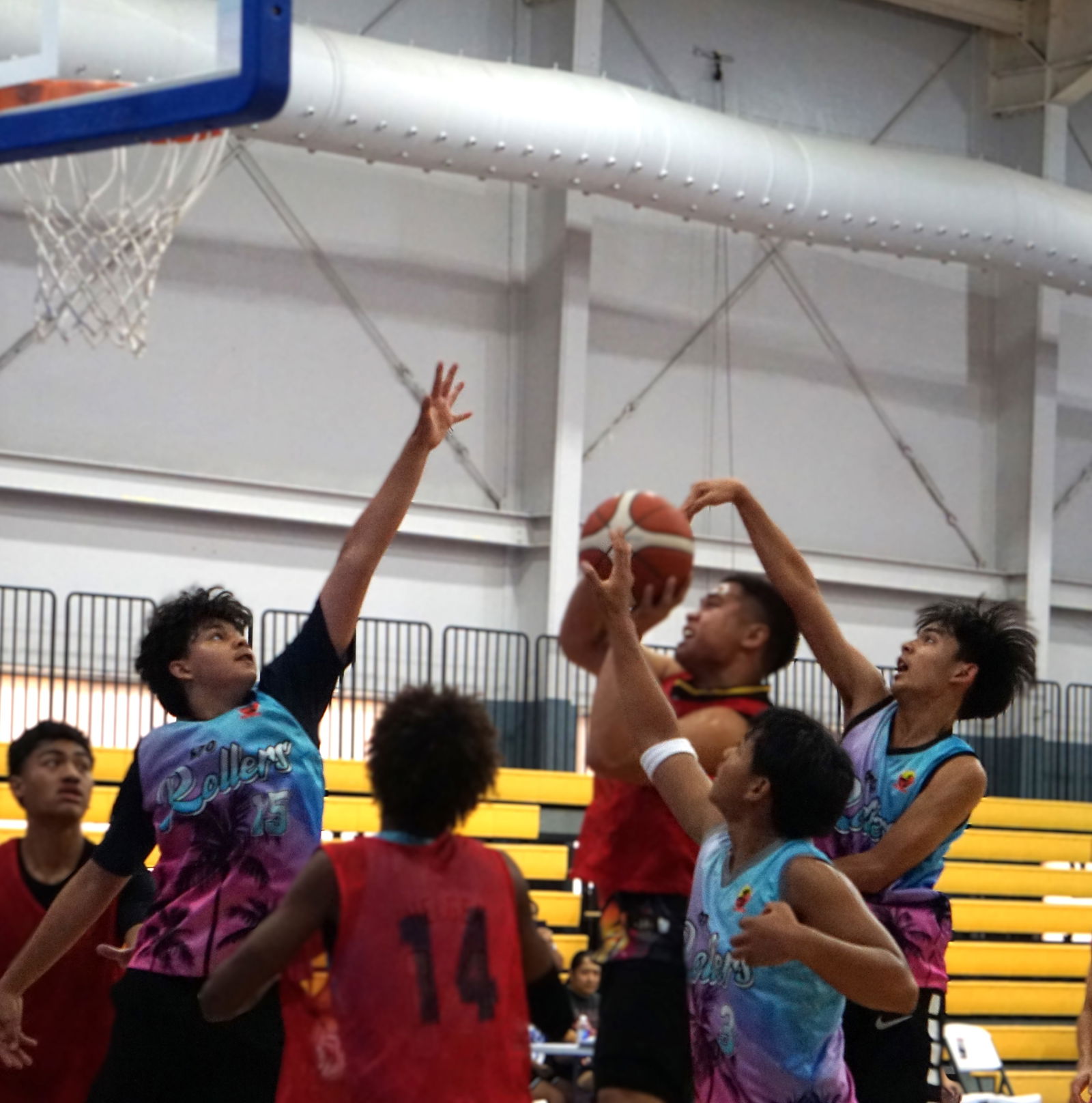 Kada Dia defenders smother a player as he goes up for a shot during a game in the U18 Boys Division of the 2025 Allied Pacific Environmental Consulting Basketball League at the Ada gym.Photo by James F. Sablan Jr.
