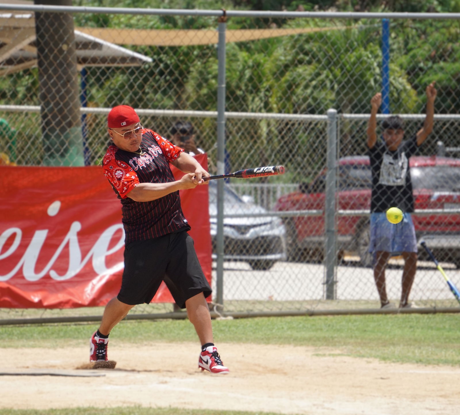 Cholos Familia’s Pete Lizama hits a single during a game in the Masters Division of the 2025 Budweiser Belau Amateur Softball Association League at the Dandan ballfield.Photo by James F. Sablan Jr.