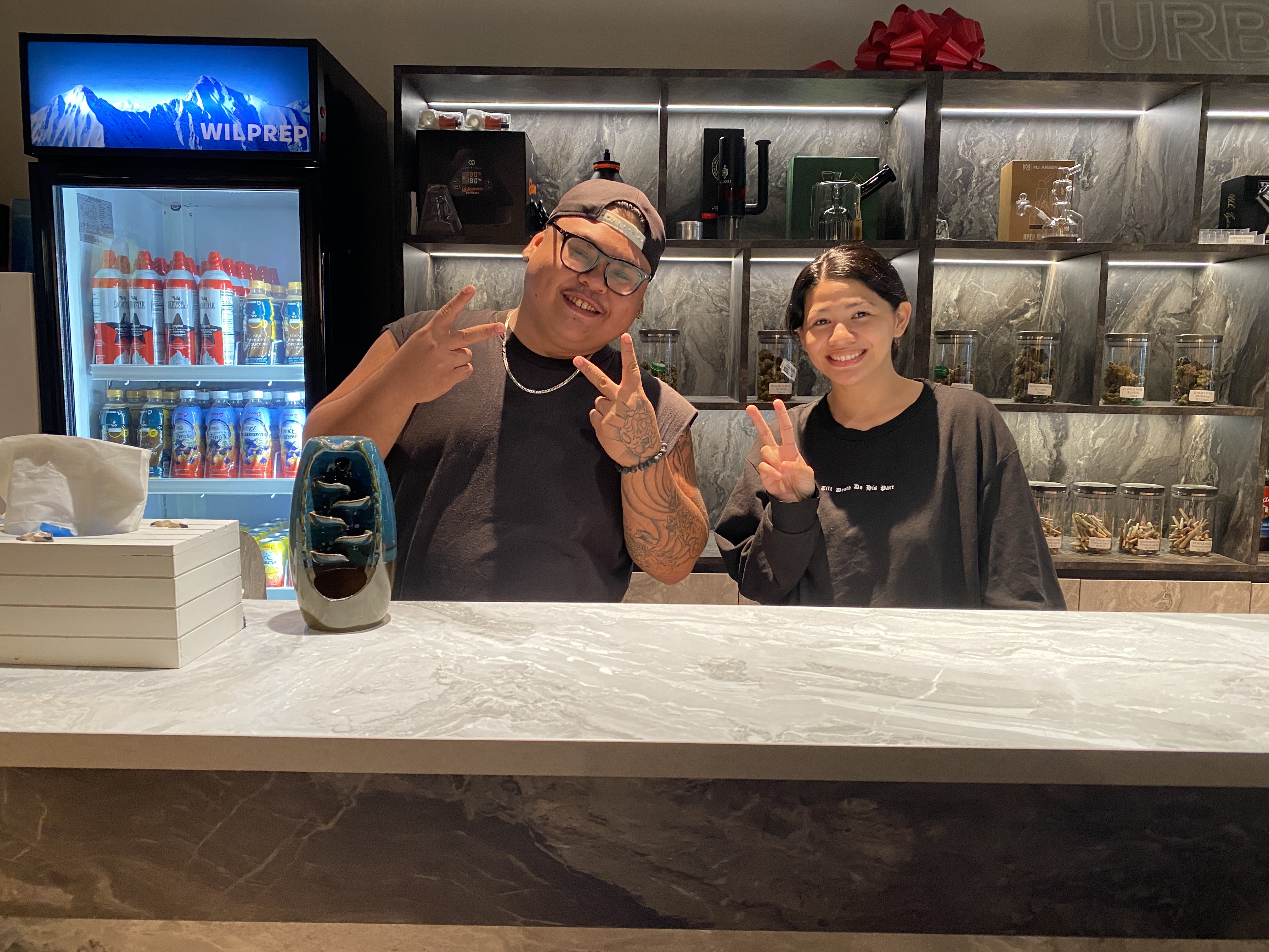 Ed Ada, left, and Shania Salas are budtenders at CannaSaipan.