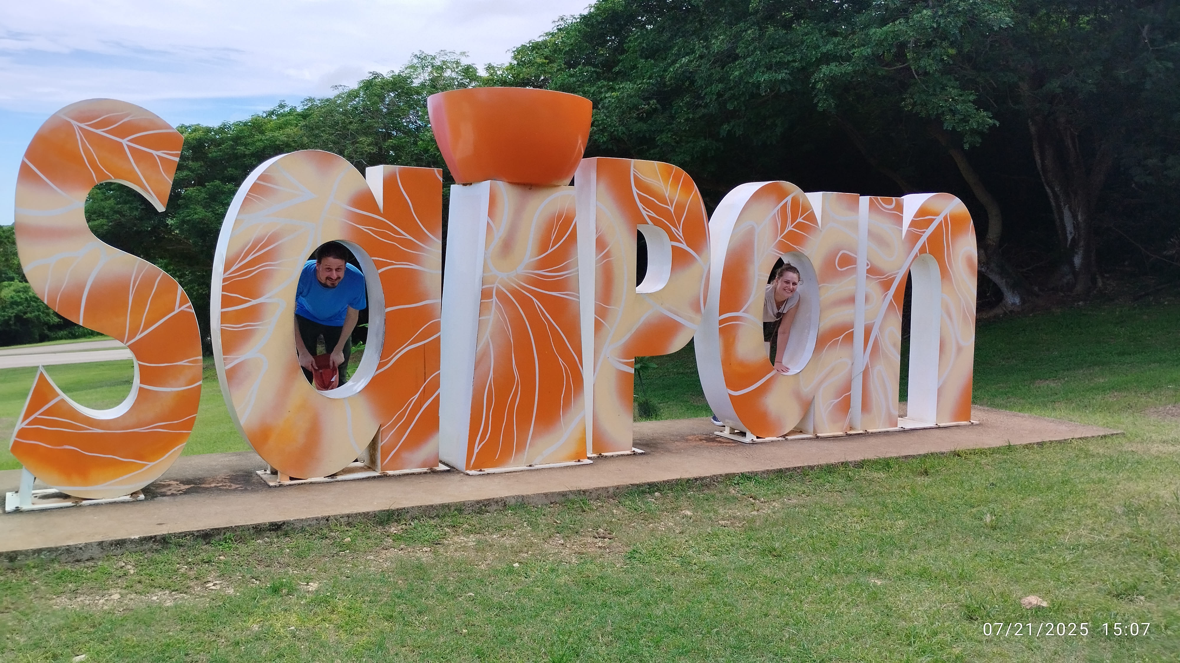 At the Saipan sign in Marpi.
