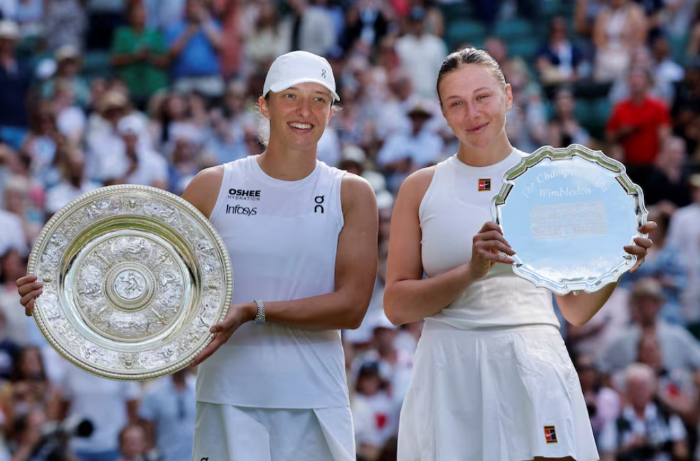 Wimbledon winner Poland's Iga Swiatek, left, poses with the trophy alongside runner up Amanda Anisimova of the U.S. after the women's singles final at the All England Lawn Tennis and Croquet Club in London, Britain on July 12, 2025REUTERS
