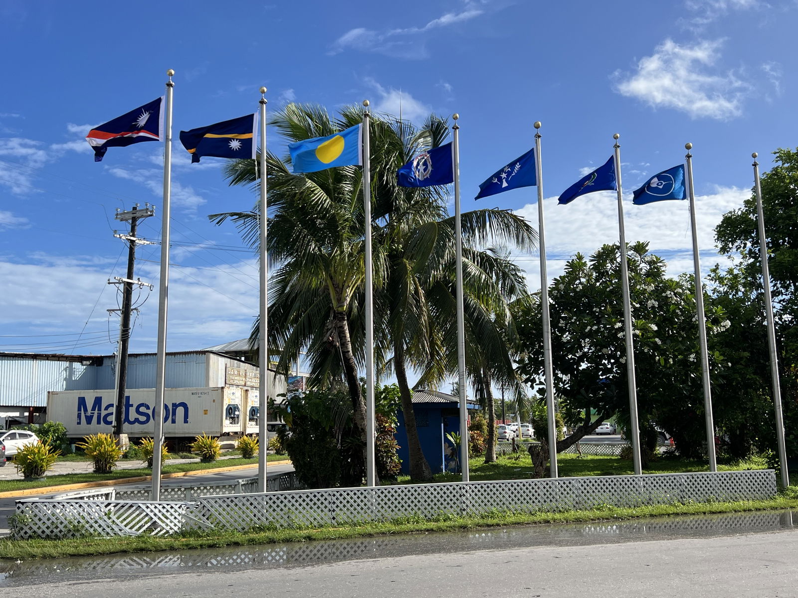 Flags from most of the Micronesian islands participating in the regional summit this week fly outside the International Conference Center in Majuro on Monday.Photo by Giff Johnson