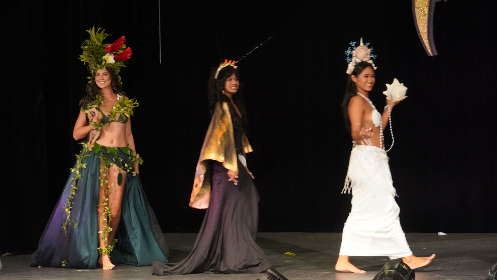 Contestants on stage for the Native Costume portion of the competition.
