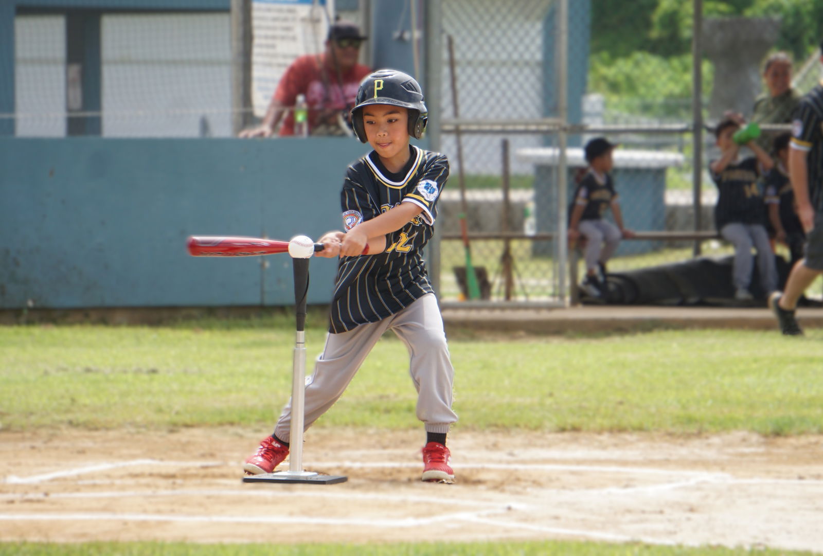 The Pirates' Callam Torres connects a single during an opening game against the Athletics in the 2nd Annual Summer T-Ball League 2025 at the Francisco "Tan Ko" Palacios Baseball Field on Sunday. ​