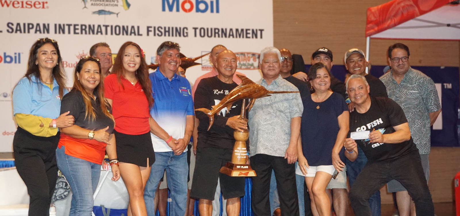 Rod Bender crewmembers pose alongside Gov. Arnold I. Palacios and SFA board members as the first-place winner in the Billfish (Marlin) category during the awards banquet for Saipan Fishermen's Association's 41st Saipan International Fishing Tournament at the Taga Hall of Saipan World Resort on Monday night.